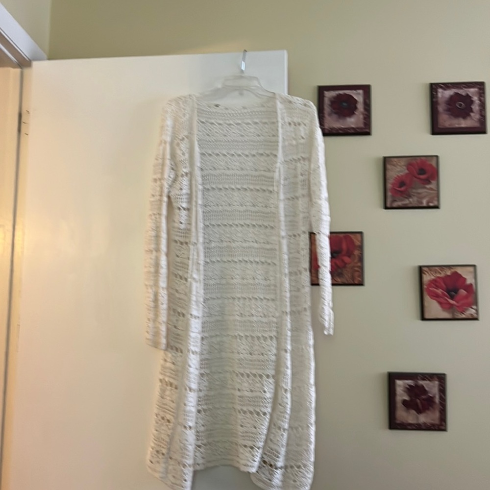 Crocheted, white duster. Perfect when wearing shorts beach wear or even skirts